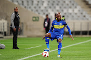 Cape Town City captain and defender Thamsanqa Mkhize in action during the Absa Premiership match against Lamontville Golden Arrows at Cape Town Stadium in Cape Town on August 18 2018 as head coach Benni McCarthy watches on in the background.  