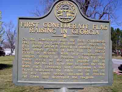 On this Courthouse lawn the first Confederate flag raising in Georgia took place March 31, 1861. Judge David B. Harrell of Webster County, Capt. James Pickett of Red Hill, Dr. Harvis Pickett of...