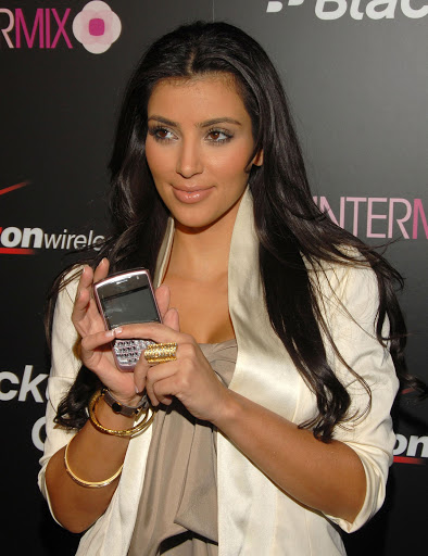 Kim Kardashian poses with a Blackberry at a launch in 2008. File photo.