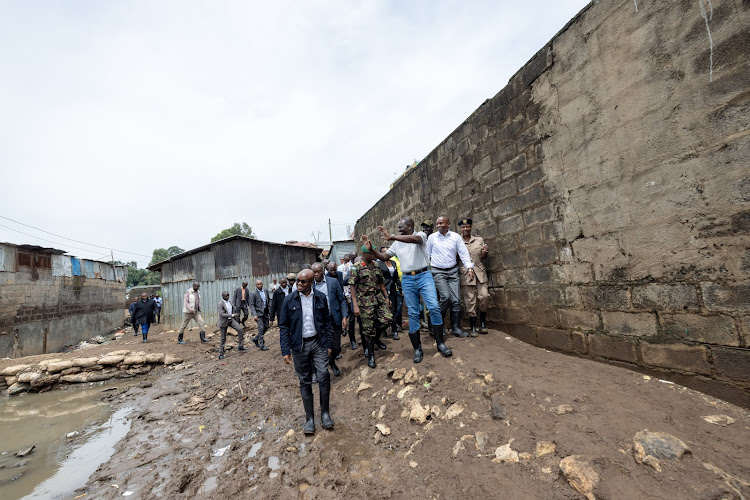 President William Ruto accompanied by other leaders when he visited Kiamaiko to assess the flood situation on April 6, 2024.