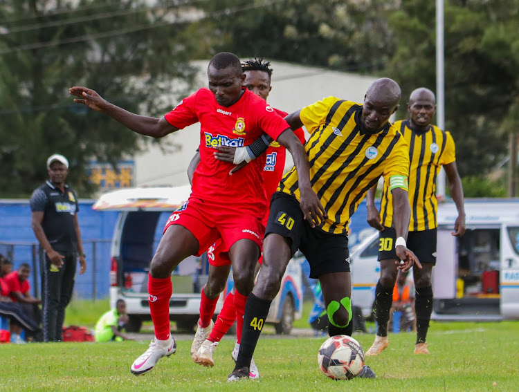 Police FC Samuel Onyango (23) tussles for the ball against Sofapaka's Humphrey Mieno (40) in a previous League match