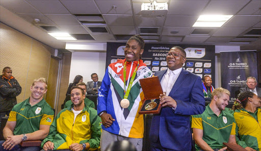 Caster Semenya with Sports minister Fikile Mbalula during the Rio 2016 Olympics Games Team South Africa welcoming ceremony at O.R Tambo International Airport on August 23, 2016 in Johannesburg, South Africa. (Photo by Sydney Seshibedi/Gallo Images)