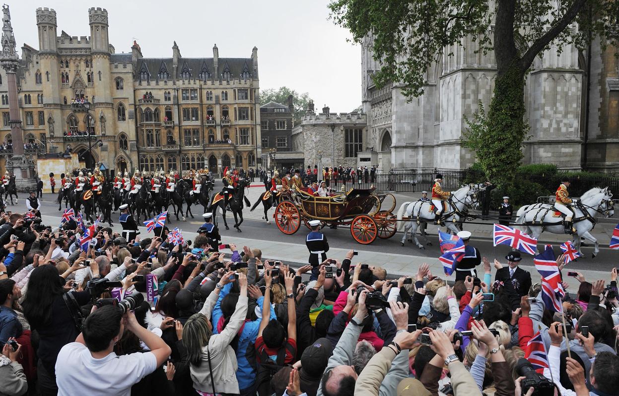 by carriage procession to