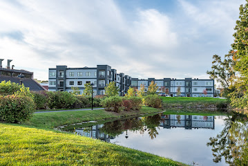 Exterior Shot of Millside Building with the River Nearby