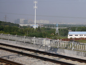 Far away view of the Guangzhou Circle from a passing high-speed train