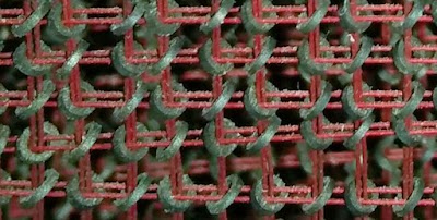 Ingredient of the core memory in the IBM 1401. Every toroidal ferrite core retail outlets one bit.