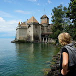 my mom observing Chillon Castle in Switzerland in Veytaux, Switzerland 