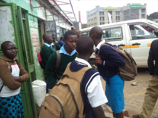 Secondary school students stranded at Kabarnet town bus stage in Baringo County after they were sent home for school fees in this file photo.