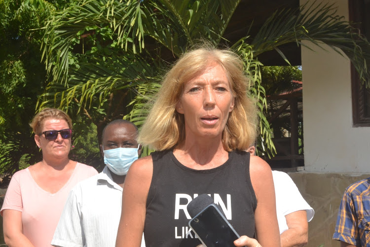 Erena Goodwin addressing reporters near the dumpsite in Casuarina