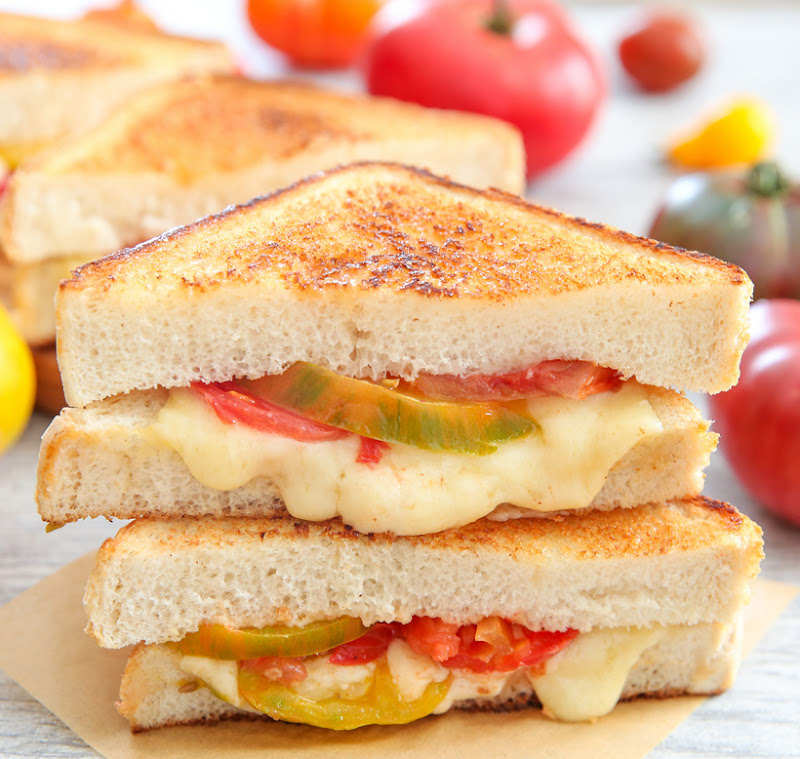 a close-up of grilled cheese tomato sandwiches