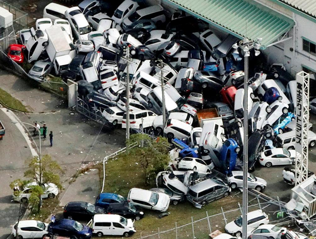 Vehicles damaged by Typhoon Jebi are seen in Kobe, western Japan, in this photo taken by Kyodo on 5 September 2018. Photo: Kyodo