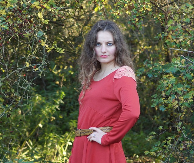 wearing a red dress in autumn