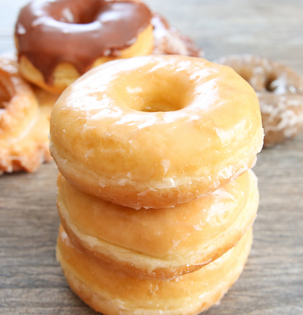 photo of a stack of three glazed donuts