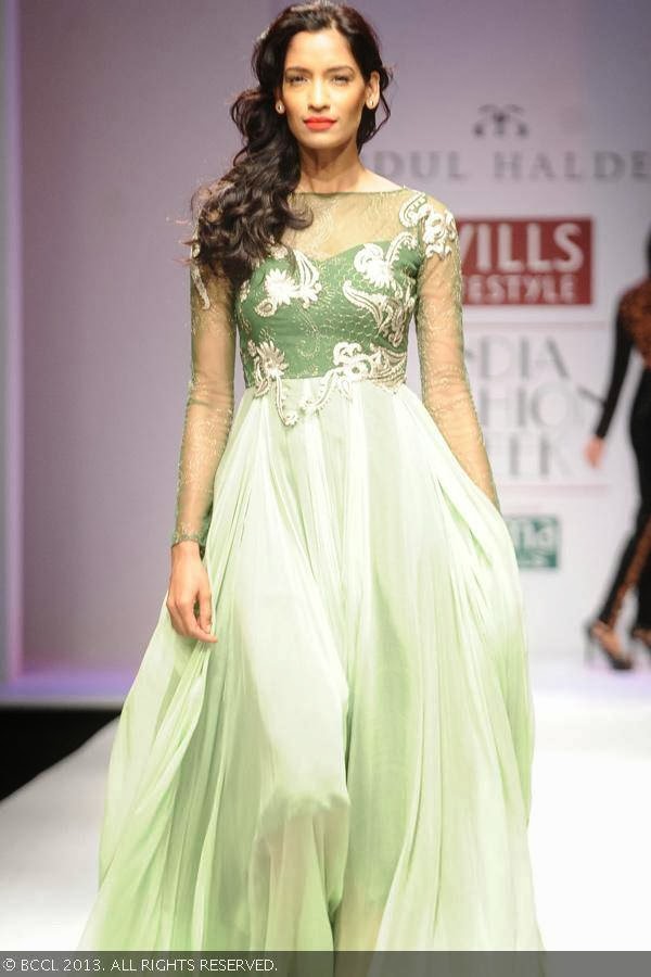 Krishna showcases a creation by fashion designer Abdul Halder on Day 4 of Wills Lifestyle India Fashion Week (WIFW) Spring/Summer 2014, held in Delhi.