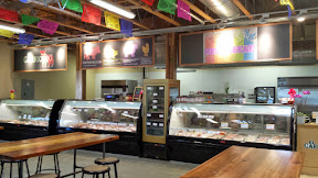 Portland Mercado, the Market Hall includes tables for dining as well as the Carnicero here.