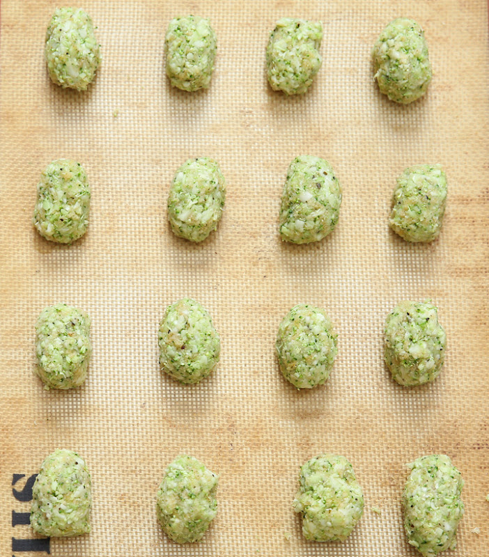 overhead photo of the tots on a baking sheet ready to be baked