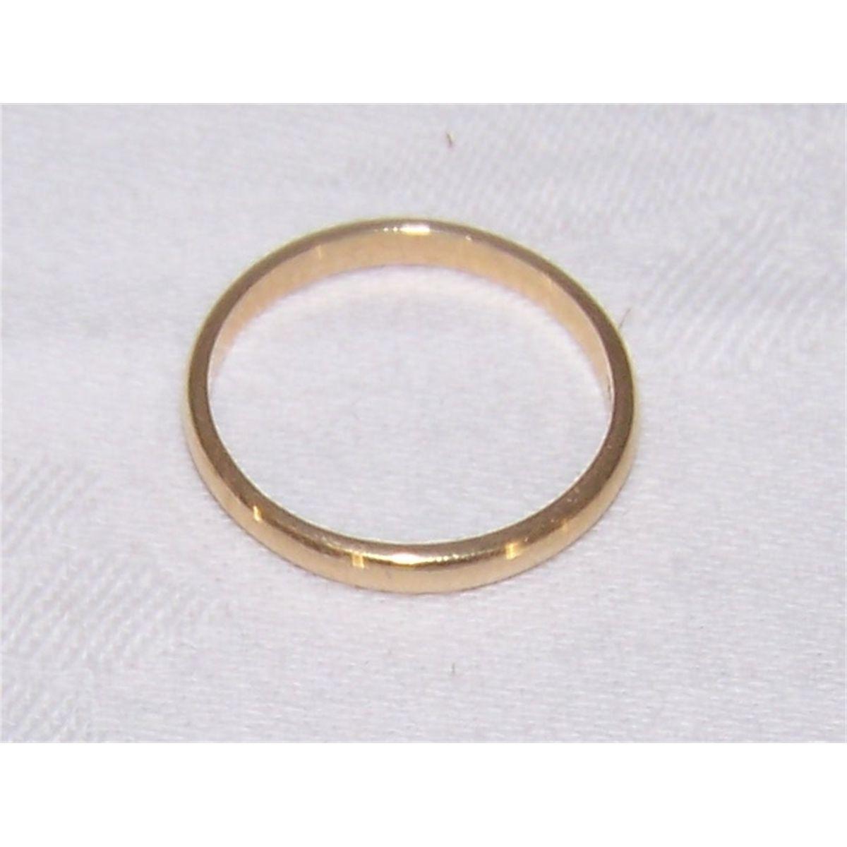 A 14 K Yellow Gold wedding band weighing 2.4 Grams