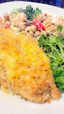 Cheddar Garlic Oven Baked Chicken Breast with gluten free pasta with cherry tomatoes and broccoli and microgreens and a touch of feta