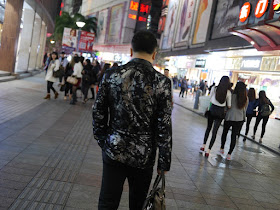 people walking on a pedestrian street in Shenzhen