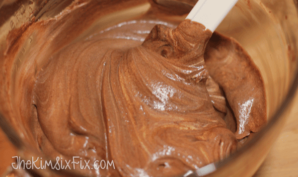 Folding in whipped cream to mousse