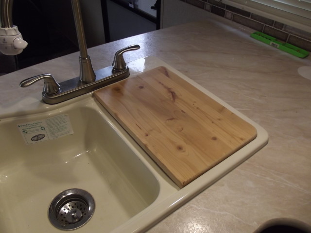 Looking for ideas for an insert to cover the sink in our Jayco 212QB for  more counter space.Is there a ready made piece or do we need to have  something made? 