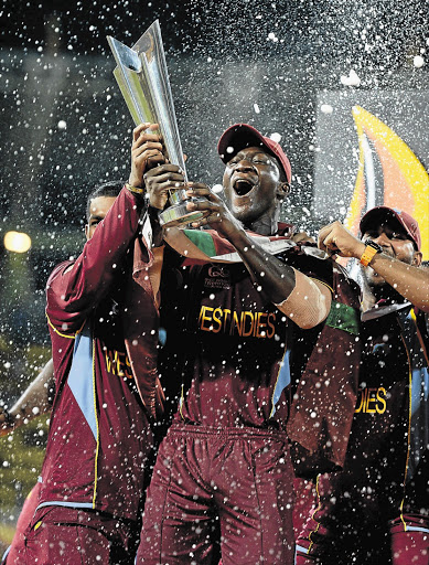 West Indies captain Darren Sammy holds the World Twenty20 trophy after the team's win in the final against Sri Lanka Picture: GARETH COPELY/GALLO IMAGES