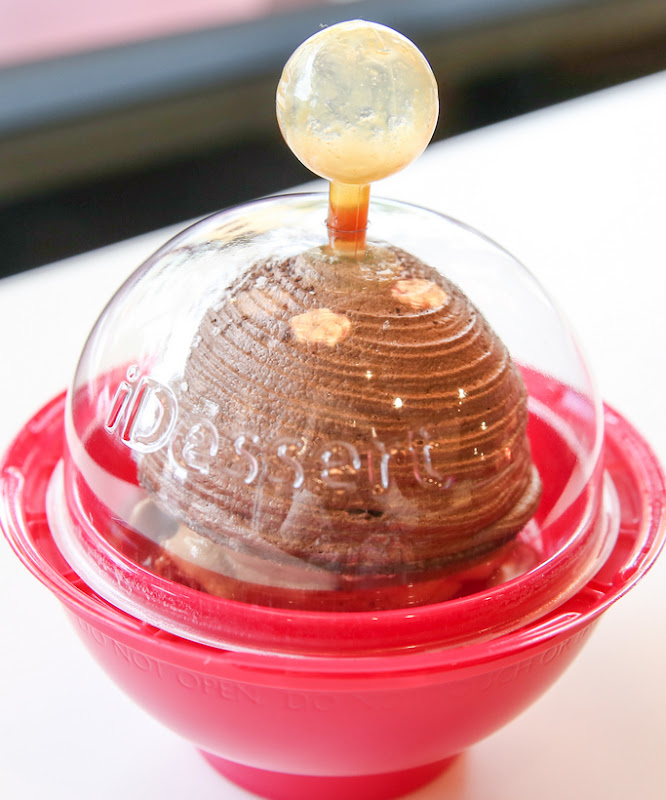 photo of the cozy dessert with the caramel sauce released from the ball