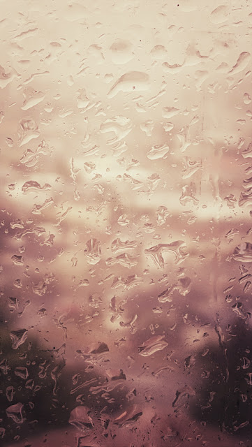 Stylised photo of raindrops on a window