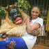 Masquerade Pictured Carrying a Beautiful Lady
