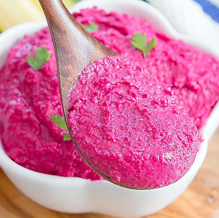 close-up photo of a big spoonful of beet hummus