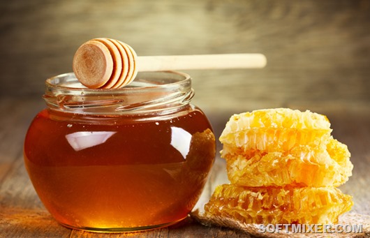 jar of honey with honeycomb