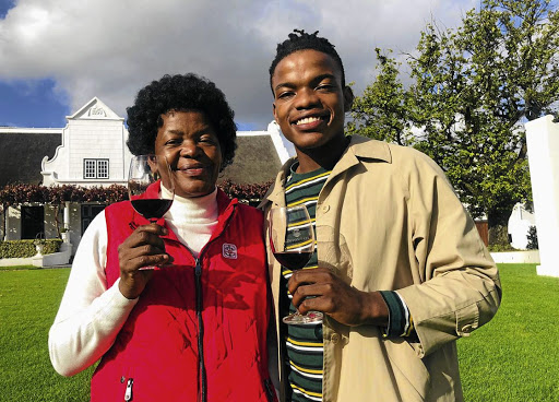 Rosemary and son Mojalefa Mosia with other family members are proud owners of Bridge of Hope wine label./Supplied