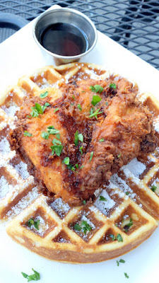 Fried Chicken and Waffle at Pink Rose Restaurant with Draper Valley Chicken that is buttermilk battered and fried, served on a malted waffle with bourbon syrup