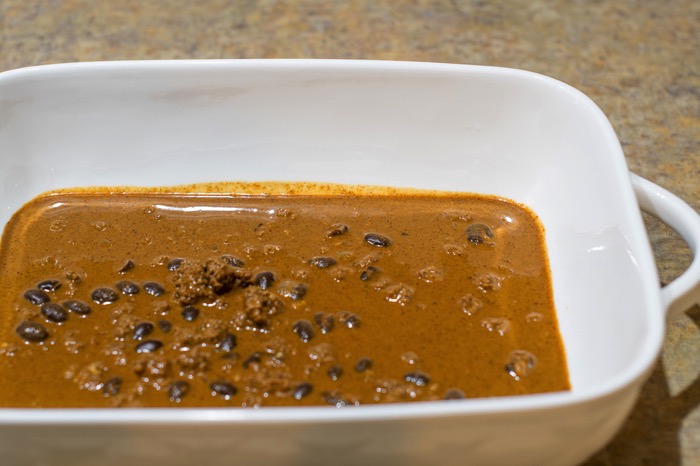 Enchilada sauce coating a pan. Enchilada sauce coating a pan