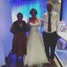 Carly findlay and parents on wedding day 