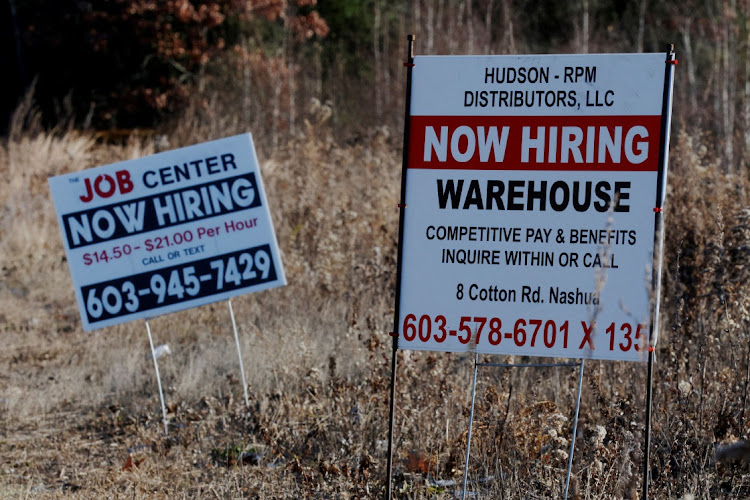 "Now Hiring" signs for jobs stand along a road in Londonderry, New Hampshire, US. File photo: REUTERS/BRIAN SNYDER