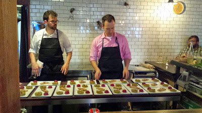 Preparing the plating of the Appetizer course, the Pkhali Trio at the Kargi Gogo Supra dinner