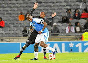 Chippa United  skipper Mark Mayambela is challenged by Orlando Pirates' Xola Mlambo   during their Telkom Knockout at Orlando Stadium in Soweto on Saturday night. 