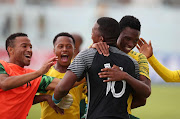 SA Under-20 players celebrate after scoring a goal. 