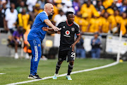 Orlando Pirates assistant coach Sergio Almenara and Paseka Mako during the DStv Premiership match against Kaizer Chiefs at FNB Stadium on February 25, 2023 in Johannesburg, South Africa.