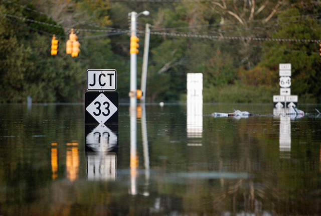 Floodwaters engulf street signs in Princeville, N.C., after Hurricane Matthew. Photo: Jonathan Drake / Reuters