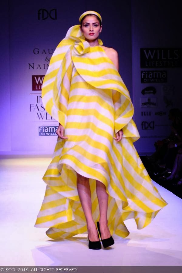 Aditi showcases a creation by fashion designers Gauri and Nainika on Day 1 of Wills Lifestyle India Fashion Week (WIFW) Spring/Summer 2014, held in Delhi.