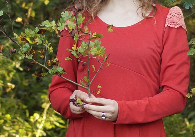 wearing a red dress in autumn