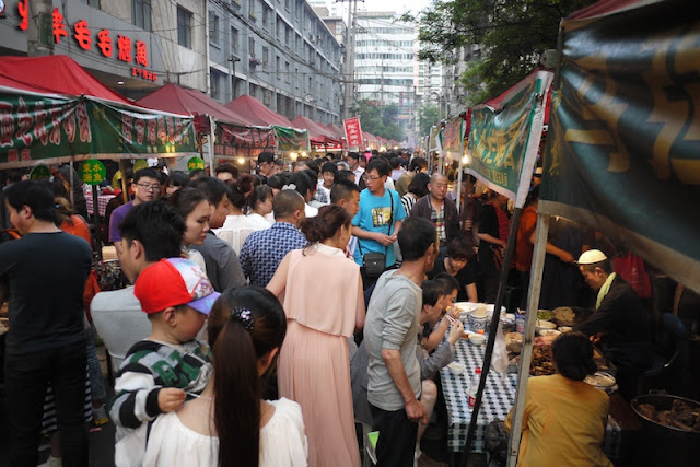 dense crowd at Zhengning Street Night Market in Lanzhou, China