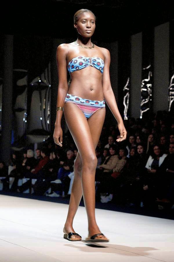 A model presents a creation by fashion brand Lalesso, a collaboration between South African and Kenyan fashion designers, on the third and final day of the Cape Town Fashion Week, at the Cape Town International Convention Centre, on July 26, 2014, in Cape Town.