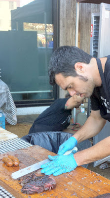 Aaron Franklin carving up the brisket and sausage for each guest