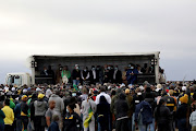 Former president Jacob Zuma addresses his supporters at his Nkandla homestead. The writer says he hides behind the gullible and the poor.