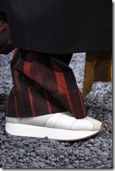 MILAN, ITALY - JANUARY 13:  A model, detail, walks the runway at the Marni show during Milan Men's Fashion Week Fall/Winter 2018/19 on January 13, 2018 in Milan, Italy.  (Photo by Pietro D'Aprano/Getty Images for Marni)