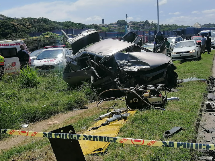 The accident scene in Durban. One suspected robber died and five others were injured.