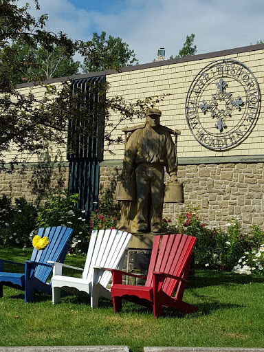 The colors of the Acadian flag at the VHA. From Acadian History Comes Alive in a New Brunswick Village 